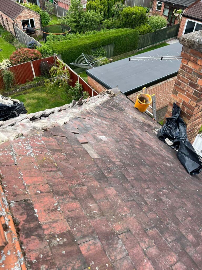 This is a photo taken from a roof which is being repaired by Stapleford Roofing Repairs, it shows a street of houses, and their roofs